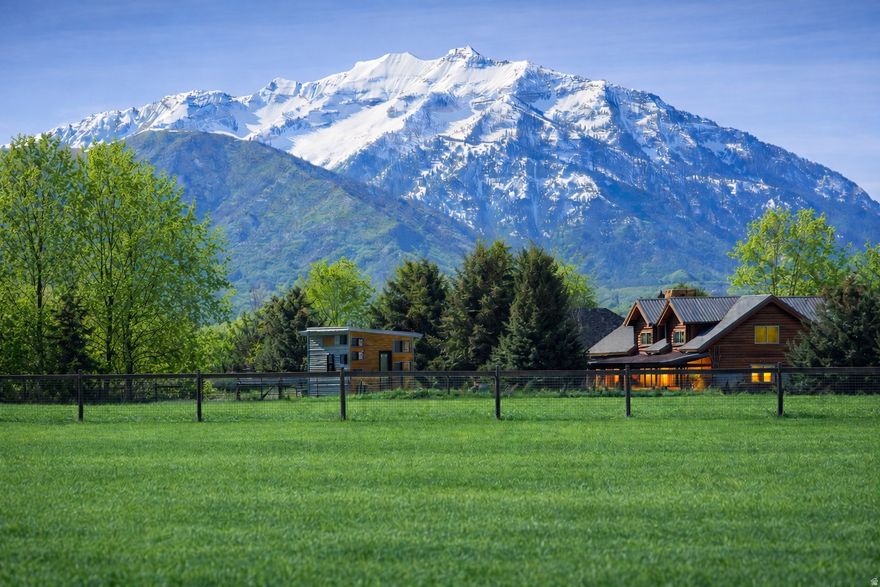 One of the finest remaining riverfront estate properties in Charleston's exclusive Winterton Farms community, this exceptional 4.59-acre homesite borders the Provo River and includes private river access - a rare and highly sought-after feature in the Heber Valley. This remarkable property offers a rare opportunity to build a private luxury estate in one of the most tightly held and difficult-to-acquire neighborhoods in the area. The property features fully usable, flat acreage - an increasingly rare characteristic for estate parcels - providing an ideal foundation for a custom residence and expansive outdoor living spaces. Water shares in Utah are valued more than gold, and this property includes 4 Charleston Irrigation Company water shares with a pressurized irrigation line already installed on the property - providing ample water to establish landscaping, plant trees, and maintain a lush property without relying on culinary water. Enjoy unobstructed 360-degree mountain views, including breathtaking panoramic views of Mount Timpanogos, creating a dramatic and ever-changing natural backdrop in every direction. The Provo River frontage provides a setting that delivers both serenity and recreation - a rare combination even among luxury properties. Whether for fly fishing, peaceful riverside evenings, or watching the abundant wildlife, the riverfront setting elevates this property into a truly special offering. Located less than one mile from Deer Creek Reservoir, owners enjoy immediate access to boating, paddleboarding, and year-round recreation while still maintaining the privacy and open-space feel that defines Winterton Farms. Large, flat riverfront parcels with panoramic views in this location are extraordinarily rare to market, making this a true legacy-caliber property for a discerning buyer seeking space, privacy, and natural beauty. A property of this quality and setting is unlikely to become available again anytime soon.