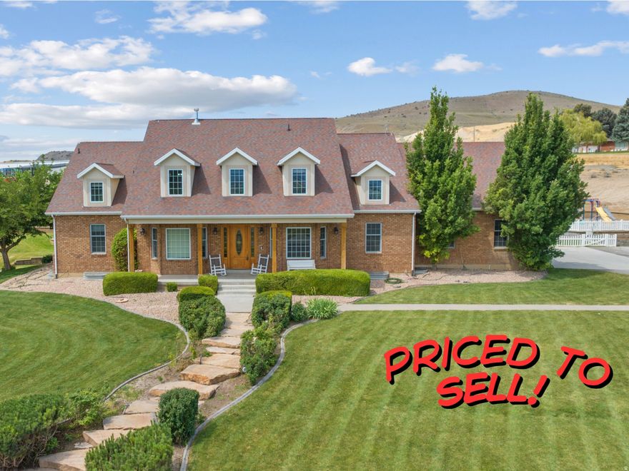 Beautiful 8,500+ sq ft home on 5.32 acres with stunning mountain & valley views! Features 8 beds, 5 full & 2 half baths, open kitchen with double ovens, 2 dishwashers & large pantry. Main-floor primary suite with walk-in closet & deck access. Finished basement with theater, kitchenette & separate entrance-ADU potential. New HVACs, tankless water heaters & 40-kW solar with battery, fenced pasture,  two outbuildings- 30' x 60' with a 100-amp power service building and a 66' x 60' shop with 200-amp power. We are not done yet!  Greenhouse, grow boxes & root cellar. Zoned for horses/livestock, near trails. Assumable 2.87% VA loan (Approximately 900,000 -non-vets eligible). Fiber internet coming soon!