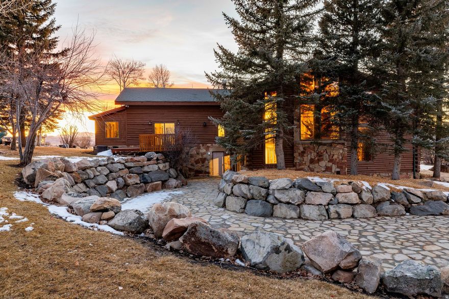 Introducing an exceptionally unique property. This expansive residence is nestled within an impressive 18-acre parcel of land in the charming Kamas Valley.This property has space for the extended family with its six oversized bedrooms and seven bathrooms. Each room has been meticulously designed to ensure comfort and luxury in every corner. The home takes full advantage of its elevated position, providing breathtaking mountain views as well as captivating sunset vistas. A saltwater spa further enhances the Master Suite, offering a tranquil retreat after a long day. For wellness enthusiasts, this home also comes equipped with both a sauna and steam room.The exterior features are nothing short of spectacular. An expansive grass lawn offers ample space for outdoor activities while the flagstone patio provides an ideal setting for alfresco dining or simply relaxing in the great outdoors. One of the most striking aspects of this property is its commitment to sustainable living - it comes fitted with solar panels which can significantly reduce energy costs. In addition, there's a detached four-car garage that includes office space - perfect for those who work from home or need extra storage space.For equestrian lovers, the horse stables will be a significant draw. Adding to the allure of this property is a separate caretaker apartment - ideal for guests or additional staff accommodation. There is also a separate pole barn to store hay next to the barn. There's also a metal barn with three-phase power that could be used for a small business or hobby. A private road leads up to this stunning estate ensuring privacy and exclusivity.Kamas is popularly known as the gateway to the Uinta Mountains and offers an array of recreational activities such as fishing, hiking, camping, and more right at your fingertips! Its close proximity to national forests allows residents to snowmobile directly from their backyard into nature's playground.This legacy estate offers not only luxurious living but also a lifestyle enveloped by nature and tranquility. It's not just a home, it's an experience that will bring your family together.