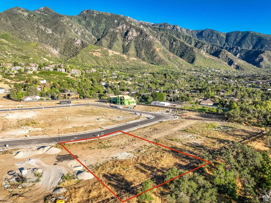 Experience breathtaking beauty from one of the most remarkable lots on the Wasatch Front. With the towering face of Lone Peak directly in front and the untouched expanse of Dimple Dell Park behind the lot, this property offers unmatched views and privacy that will never be compromised. Mountains falling at your feet in the front, and literally, your backyard touches some of the finest equestrian, hiking, and biking trails in Salt Lake County. Surrounded by luxury homes ranging from $2.5M to $5M, this lot sits in one of the area's most sought-after neighborhoods, just minutes from Big Cottonwood Canyon and world-class skiing. Whether you envision a serene mountain retreat or a statement estate, this is a once-in-a-lifetime chance to own one of the most prestigious parcels in the community.