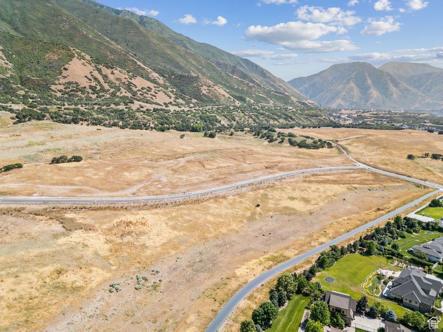 Welcome to Lot 58 in The Preserve at Mapleton-one of Utah County's most exclusive and sought-after communities. Perched on the scenic foothills of Maple Mountain, this expansive homesite offers an exceptional combination of natural beauty, privacy, and lifestyle. Take in sweeping views of the Wasatch Mountains, with breathtaking sunsets stretching over the valley and Utah Lake. Direct access to The Preserve's private trail system, a stocked fishing pond, sandy beach, shaded pavilions, and a beautifully maintained 7+ acre park makes every day feel like a retreat. Lot 58 is zoned for up to three horses, making it an ideal setting for those seeking space, tranquility, and an equestrian lifestyle-all just minutes from city conveniences. Whether you're envisioning a modern mountain retreat or a timeless estate, this homesite provides the perfect canvas to build your dream home in one of Utah counties most desirable settings.