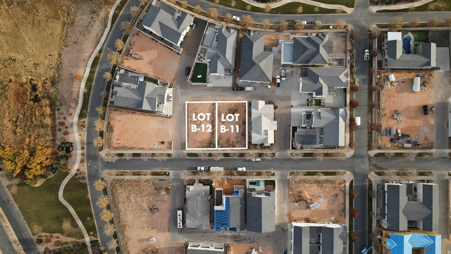 Discover the best of Elim Valley with these two available vacation rental-approved lots, B-11 and B-12. Your builder or build to suit with our custom home builder! This premier community offers a luxurious setting with amenities like a resort-style pool, lap pool, hot tub, and clubhouse, creating an ideal retreat for homeowners and guests alike. Nestled minutes from Sand Hollow, these lots are perfectly located for boating, ATV adventures, golfing, and hiking. Design and build your dream European-inspired villa and enjoy the investment potential of this vacation-friendly neighborhood!