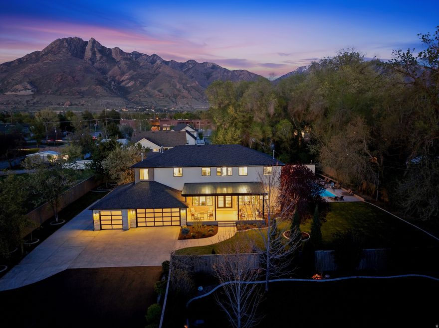 Beautiful, private estate lot at the end of a private lane.  Abundant large trees with birds and squirrels chasing each other.  Completely remodeled; feels brand new inside and out.  Your dream kitchen with new natural rift oak cabinets, all new appliances including  36" column Sub-zero refrigerator, 36" column Sub-zero freezer, 3 Wolf ovens (one steam), Wolf induction cooktop, 2 Cove dishwashers, double bar seating (at island and at window), large island, walk-in pantry and multiple cabinet pantries, natural stone countertops, built in trash cans and abundant storage.  This is a kitchen you will remember and love.  Four washers and four dryers spread appropriately throughout the home.  Beautiful and tasteful stone throughout including around 2 large electric fireplaces.  Engineered hardwood floors throughout.  Brand new high efficiency fiberglass windows.    Large built in saltwater sports pool and hot tub both with very high end pebble and glass finish.  Large stacking sliding glass doors bring the outside pool and hot tub areas and inside living room into a common entertainment / living / resort area.  The pool hosts dual basketball hoops plus volleyball.  Primary suite is luxurious and includes a large and comfortable steam shower and a large stand alone solid surface soaking tub.  The primary closet is fit for a luxury home magazine.  The secondary bathrooms are beautiful and comfortable.  Two primary bedrooms, one up and one down.  Large, private lot that will make you feel that you are on vacation at a luxury resort.  Large trees make it feel luxurious and private.  Natural stone inside and out.  High flow tankless water heaters add to the luxury of the estate.  The basement family room is large and comfortable and includes a luxurious bar with a 3rd dishwasher.  Dual offices give plenty of room for you both to work in privacy, with one having direct bath access.  And to top off everything else, this home is smart!!  Smart lights, appliances, thermostats, doorbell, fireplaces, toilets, sprinkler controllers, pool, garage door openers, smoke detectors, front door lock, and even the kitchen sink.  They are all smart. It is currently running 3 Gbit fiber internet.  It is a home you should see and will remember.    Square footage figures are provided as a courtesy estimate only and were obtained from county records.  Buyer is advised to obtain an independent measurement.