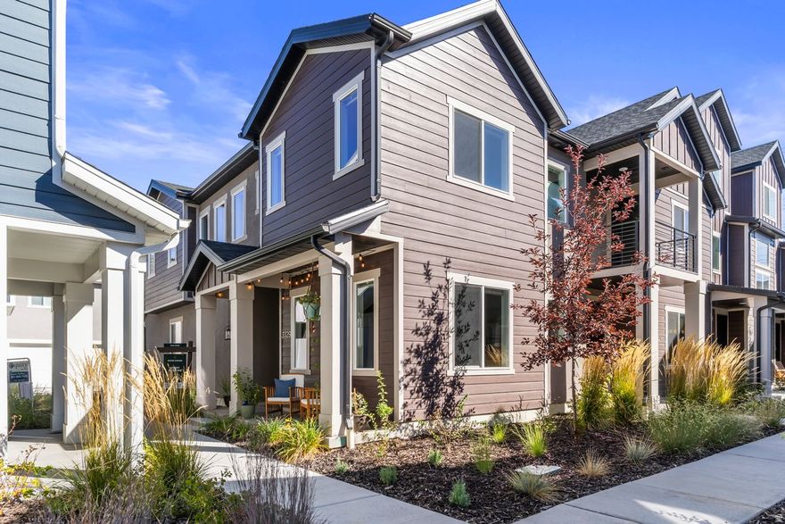 Better than NEW, this chic and sleek 2023 END Row townhome is energy star rated. The open concept floorplan and nine foot ceilings flood the home with an abundance of natural light. Clean and modern lines, quartz countertops, two tone maple soft-close cabinets, and stainless steel appliances are just a handful of many amenities. Retreat upstairs to the generously oversized bedrooms with private en-suites separated by the laundry room. Both bedrooms include walk-in closets spacious enough to be furnished as a loft or multipurpose room. An attached two-car garage provides secure parking and has been outfitted with MyQ for enhanced convenience.  This home is less than five minutes from the Roy Frontrunner station, making a date night to downtown SLC or an airport commute seamless. The Denver Rio Grande Western Rail Trail, which runs over 23 miles along the West Corridor is also steps away, in addition to countless parks.