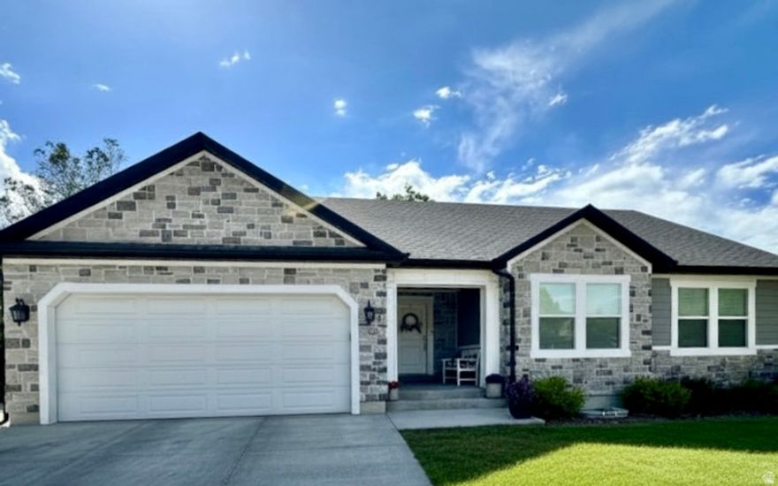 Beautiful & immaculate describes this 6 bedroom home. Open and spacious floor plan. Gas fireplace. Custom white kitchen cabinetry  with solid surface counters, Gas range. Custom white cabinets in laundry room. Large family room in basement. Huge workout room or additional storage area. Covered patio in back yard. RV Parking. You will love this great family home located in the heart of town.