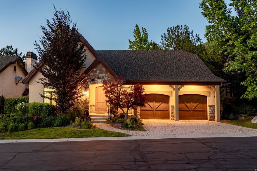 Set within the exclusive gated community of Monte Luca, this beautifully appointed residence offers elevated main-level living in a tranquil, picturesque setting defined by mature landscaping, peaceful water features, and timeless design. Step inside to vaulted ceilings with exposed wood beams, rich hardwood plank flooring, and thoughtfully curated finishes throughout. The gourmet kitchen has granite countertops, stainless appliances with a warming drawer, a gas range and a window above the kitchen sink that looks onto the pond. The kitchen opens up to the dining area and great room, where striking custom built-ins frame the fireplace and create a warm yet refined gathering space. The primary suite is grand with a spacious bedroom with soaring vaults and large windows looking out to the pond. The bathroom has marble countertops, double sinks, a walk-in shower, jetted tub and a walk-in closet with an island in the middle for maximum storage and convenience. The laundry room is also on the main level, so the livability and access of all items on the main level is perfect. Found in the lower level you have high ceilings, a workout area, two more bedrooms, one of which was converted to a craft room/office. The family room has another beautiful fireplace that anchors the space, a kitchenette with breakfast bar is great for guests staying or movie night. Outdoor spaces feature a covered deck and patio areas overlooking the peaceful pond, ideal for quiet mornings, evening dining and effortless entertaining. Other features include: a reverse osmosis water system, new paint on the walls throughout, epoxy coating on the garage floor and ample storage in the home & garage. Residents of Monte Luca enjoy an exceptional lifestyle with gated privacy, impeccably manicured grounds, and access to the community clubhouse, all within one of Cottonwood Heights' most coveted settings. Ideally located near Big and Little Cottonwood Canyons for Alta, Snowbird, Solitude & Brighton ski resorts, Willow Creek Country Club and a quick commute to Salt Lake City and the International Airport.