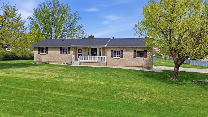 Well-maintained 1.25-acre Mendon property with space to spread out. Bright main living area with granite countertops, matching appliances, and updated bathrooms. Main level offers 2 beds/2 baths, with 3 additional bedrooms and a full bath in the walk-out basement.  Recent updates include new roof, fresh interior and exterior paint, and a 2023 boiler system. Efficient instant water heater, water softener, and heated garage.  Fully landscaped with mature trees, secondary water, garden space, pasture, and multiple outbuildings including a 14' x 24' shed/shop. Flat, usable lot with room for animals, hobbies, or extra storage.