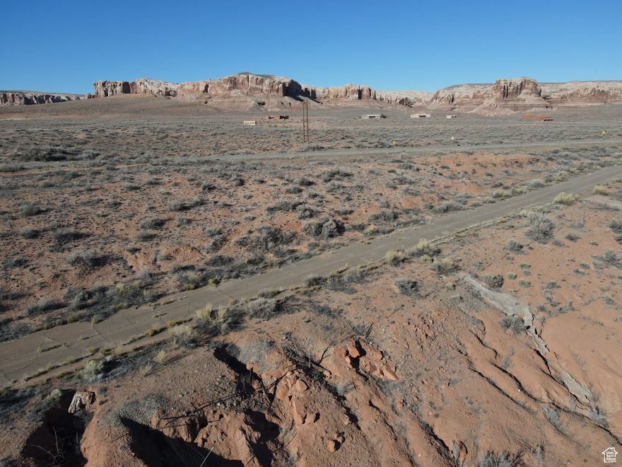 5.98 acre parcel just off Highway 191 in scenic Bluff UT. Splendid views of mountains and red rocks. Several possible homesites exist on this mostly flat parcel, southwest of downtown. There is an electric pole near the lot. A water well could be needed, unless Bluff Water Works brings water service to the lot. Septic system will be needed. The parcel address is estimated, subject to confirmation by the city or county. Learn more about Bluff at http://townofbluff.org. Information is deemed reliable. Buyer to verify all information.