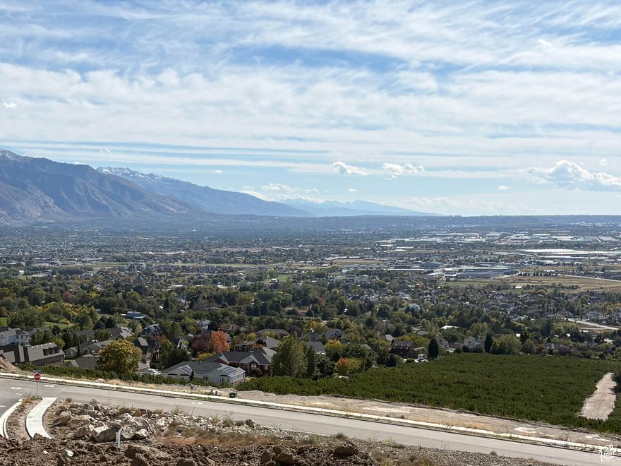 Nestled High on the Beautiful Pleasant View Bench, this stunning 0.40-Acre lot showcases sweeping Mountain and valley views along with breathtaking sunsets. The property offers the perfect setting for a custom home designed to highlight the area's natural beauty and serene surroundings. Enjoy the peaceful atmosphere while being just minutes away from hiking trails, skiing, parks, and local conveniences. this rare view lot provides an exceptional opportunity to build your dream home in one of Pleasant View's most desirable locations.