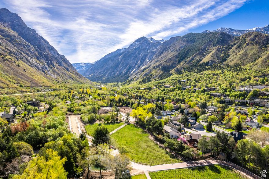 Located at the base of Little Cottonwood Canyon, The Estates at La Caille present an unparalleled opportunity to secure a buildable lot in one of the Valley's most prestigious enclaves. These expansive lots, paired with the freedom to select your own builder, offer buyers the chance to craft a truly custom legacy residence. With only a limited number of lots available, this represents a rare occasion to reside adjacent to the exquisite La Caille grounds. Lot 12 captures exceptional panoramic canyon and mountain views and is adjacent to the new vineyards. This property borders La Caille and will enjoy an expanded yard of the finely manicured La Caille grounds. This lot will also include an easement for added privacy from a lovely development gate and privacy wall inspired by the legacy of La Caille along with a serene water feature. These elements are in progress and will be completed soon. Ideally situated just minutes from Utah's premier recreational destinations-including the Cottonwoods, scenic hiking and biking trails, and world-class skiing-and less than 30 minutes from the vibrant heart of downtown Salt Lake City and the newly expanded International Airport, these lots deliver an exceptional blend of serene seclusion and convenient access.