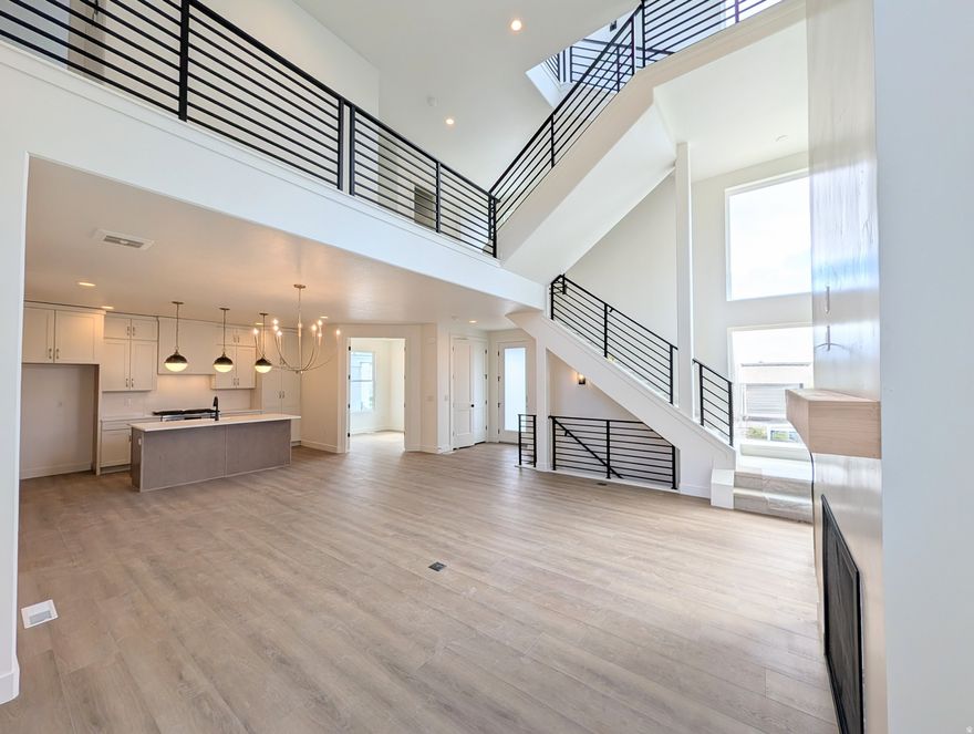 Show-stopping home nearing completion! This stunning Innovator Sky home features a third-level Sky Room with a wet bar and breathtaking views overlooking the Watercourse. Step outside to the east-facing, hot tubready Sky Deck, perfect for entertaining or relaxing while taking in the scenery. Thoughtfully upgraded throughout, this home includes a finished basement, quartz countertops and quartz backsplash, gas range, upgraded cabinetry, hard-surface flooring, modern railing, and a cozy gas fireplace. The open-concept layout offers a spacious great room that flows seamlessly into the dining area and kitchen, along with a convenient main-level office, ideal for working from home. Located in the highly desirable Watermark Village at Daybreak, you'll enjoy easy access to the watercourse and an incredible lineup of community amenities. Estimated completion: April-May 2026. Photos are of the actual home.
