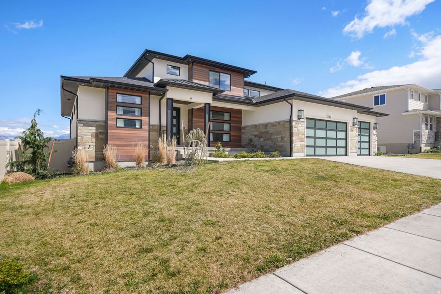 GRAND PREMIERE OPEN HOUSE- SATURDAY, 4/18/2026 FROM 12NOON TO 3 PM-PRICED TO SELL with unbeatable views in Saratoga Springs! This stunning 4,647 sq ft home combines space, style, and opportunity. Featuring a main floor office, 3 spacious bedrooms, 2.5 bathrooms, and a large loft overlooking the open great room, the layout is both functional and impressive. The primary suite offers a luxurious retreat with a custom oversized shower. The chef's dream kitchen is a true showstopper, complete with a built-in Sub-Zero refrigerator and high-end finishes-perfect for entertaining or everyday living. Step out onto the back deck and take in breathtaking views of Utah Lake and the surrounding mountains. With a full unfinished basement, there's incredible potential to expand and customize to your needs. All wrapped in a beautiful contemporary exterior, this home offers the perfect blend of luxury, space, and value. Don't miss this opportunity-homes like this don't last long!  Square footage figures are provided as a courtesy estimate only and were obtained from County Records. Buyer is advised to obtain an independent measurement.