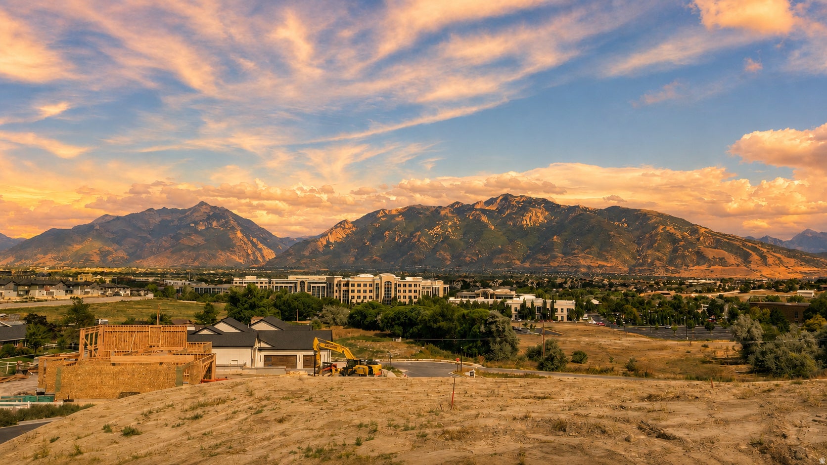 Mountain backdrop with expansive terrain, featuring new construction with a two-car garage