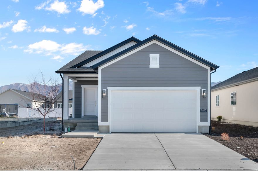 This stunning Randall home is located in a great Stansbury Park community! This home showcases white laminate cabinets and quartz countertops paired with stainless steel gas appliances for a sleek, modern kitchen. The open layout features laminate hardwood, tile, and carpet flooring, accented by can lighting and two-tone paint for added style. Enjoy year-round comfort with a tankless water heater and the refined look of Craftsman base and casing. The owner's bathroom offers quartz shower surrounds and satin and brushed nickel hardware, completing this elegant and energy-efficient home. Comes fully landscaped for a turn key experience!