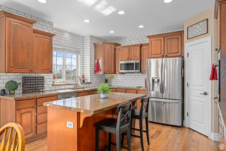 Located just a short walk from Timpanogos High School and minutes from premier shopping, dining, and scenic hiking trails, this beautifully maintained home offers the perfect blend of convenience and comfort. Enjoy unobstructed views of majestic Mount Timpanogos from the front of the home, and relax in the professionally landscaped backyard-an ideal setting for outdoor relaxation or quiet evenings. Step inside to an inviting open-concept kitchen, dining, and living area, designed for effortless entertaining and everyday living. The fully finished basement features a custom, professionally installed theater room that opens through elegant French doors to a spacious bonus flex area, perfect for game nights, large gatherings, or a home gym. Additional highlights include a new roof installed in November 2024 and thoughtful updates throughout. Square footage figures are provided as a courtesy estimate only and were obtained from county records. Buyer is advised to obtain an independent measurement.