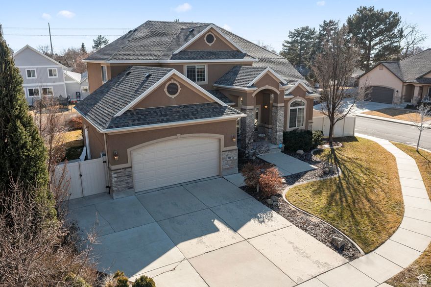 Located just a short walk from Timpanogos High School and minutes from premier shopping, dining, and scenic hiking trails, this beautifully maintained home offers the perfect blend of convenience and comfort. Enjoy unobstructed views of majestic Mount Timpanogos from the front of the home, and relax in the professionally landscaped backyard-an ideal setting for outdoor relaxation or quiet evenings. Step inside to an inviting open-concept kitchen, dining, and living area, designed for effortless entertaining and everyday living. The fully finished basement features a custom, professionally installed theater room that opens through elegant French doors to a spacious bonus flex area, perfect for game nights, large gatherings, or a home gym. Additional highlights include a new roof installed in November 2024 and thoughtful updates throughout. Square footage figures are provided as a courtesy estimate only and were obtained from county records. Buyer is advised to obtain an independent measurement.