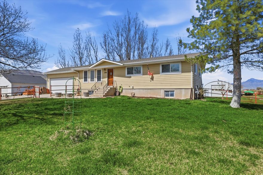 Welcome to the county! Check out this 3 bed, 2 bath rambler in Garland on 1 acre with animal rights while it lasts!  Features a 30x40 drive-through shop with 220 power, attached 2-car garage, and unfinished walkout basement. Updated flooring, paint, and vinyl windows. Primary suite with 3/4 bath.