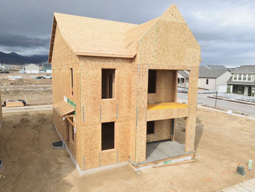 Construction has begun on this brand-new modern-design home! Step inside to discover 9-ft ceilings on every level, creating a bright and open atmosphere throughout. The main level features a dedicated office or bedroom ideal for remote work or study, and flows seamlessly into an upgraded kitchen complete with high-end finishes perfect for both everyday living and entertaining. Upstairs, the spacious primary suite includes a private balcony. Large windows throughout fill the home with natural light, enhancing the open spaces of this thoughtfully designed layout. Located in the desirable Watermark Village in Daybreak community, you'll enjoy access to parks, trails, and the Watercourse all just minutes away. Estimated Summer 2026 Completion. *Interior finished photos are of a previously built home of a similar floor plan for example purposes. Upgrades and finishes will vary*