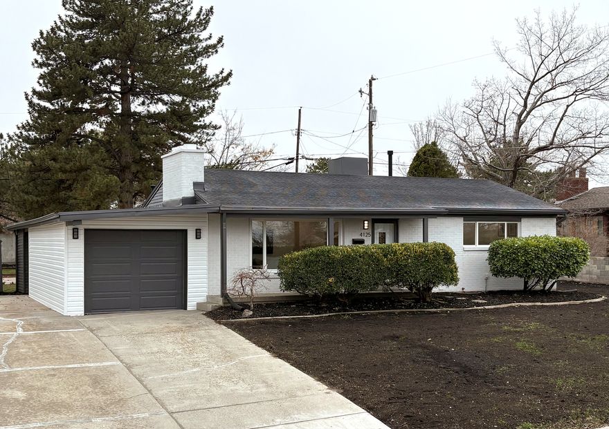 Welcome to 4125 W. Benview Drive, a beautifully remodeled rambler in West Valley City. This home has been fully renovated top to bottom, including a gorgeous ADU. Just under 2,700 sq ft, this home sits on a 0.25-acre lot, featuring a large secluded backyard with 2 sheds, garage parking (w/ EV hookup), large carport, mature trees, new sprinkler system. On the main floor, you'll find a large living room with picture window, leading into a completely new kitchen with gas stove, quartz countertops, and counter depth refrigerator. The main floor has plenty of natural lighting, as well as recessed lighting. This level also offers three bedrooms, two full bathrooms (including a master suite), French doors to the backyard, numerous closet spaces, and a dedicated laundry area. The lower level ADU features a private entrance, two large bedrooms (w/ downstairs master), a full bathroom, a second full kitchen, and a separate laundry - perfect for flexible living arrangements, extended household needs, or passive income!!! New full HVAC with dedicated upper/lower zone systems, and new tankless H2O system, new attic insulation, newer roof. Location-wise, this home is truly well-positioned: it's about 1 minute from grocery store, restaurants and shopping, roughly 5 minutes to I-215 freeway access, around 1213 minutes to Salt Lake City International Airport, This is a rare opportunity to own a completely modernized, move-in-ready home with exceptional flexibility and in a future-forward location. Come see it before its gone!