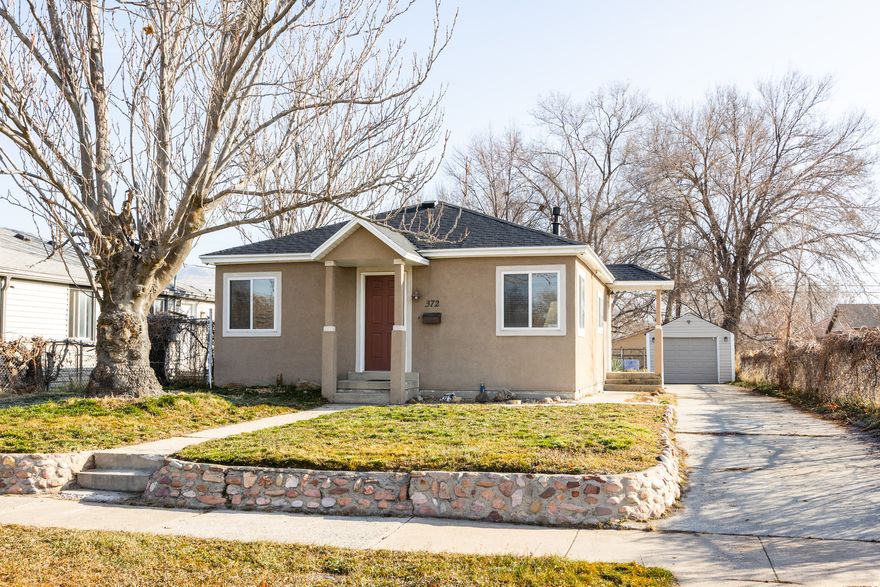 This small bungalow in the Fairpark neighborhood, just 5-10 minutes from both downtown Salt Lake city and the airport, is brimming with potential and ideal for first-time home buyers or anyone looking to downsize. A stone border out front surrounds the lawn and lends some curb appeal, but once inside, you'll see this home's limitless potential. A blank palette of sorts, you'll find that enough updates have been made to ensure comfort and convenience-it got a new roof and kitchen remodel in 2025, and the paint and carpet are new-but a few charming details remain in the form of some original wood flooring and an arched doorway from the living room to the hallway. The aforementioned kitchen is clean and simple, offering plenty of counter and cupboard space for all your prep-and-cook needs, as well as a pantry for storage. A tidy laundry room affords practicality, and out back, you'll find that the possibilities are endless. A one-car garage is perfect for cold winters and much-needed storage for all your gear, and the lawn is large and sprawling-whatever your vision for the ideal outdoor space, there's room here to accommodate. The neighborhood here is friendly, walkable and quickly growing, so we suggest getting in while you can.