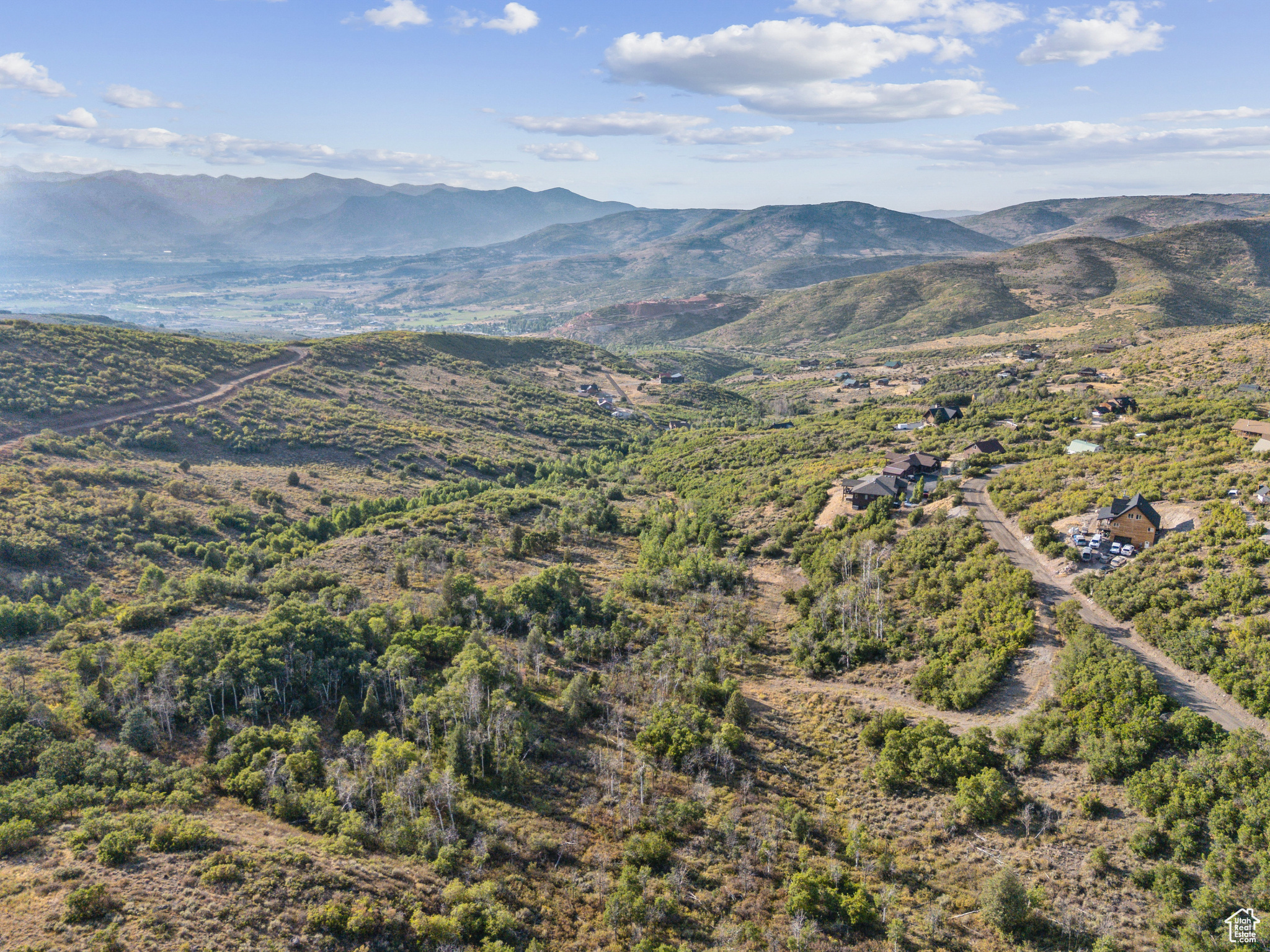 Discover unmatched privacy and sweeping western views from this 1.5-acre homesite in Timber Lakes, a gated mountain community just minutes from Heber City, Deer Valley East Village, and both Jordanelle and Deer Creek Reservoirs. Tucked into a quiet, wooded setting, this lot offers the ideal canvas for a custom retreat or full-time residence. Embrace year-round access to Park City's four-season lifestyle, including skiing, boating, hiking, and more.