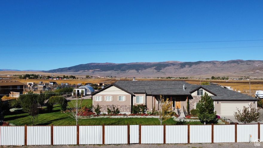 Welcome to an extraordinary estate in the heart of Monroe, Utah! This immaculate 3,990 sq. ft. home sits on just over 5 pristine acres, offering both luxurious living and the perfect touch of country charm. Surrounded by breathtaking mountain views, this property is truly one of a kind. Step inside to an open-concept floor plan where the kitchen and living room come together beautifully-featuring custom cabinetry, double ovens, an oversized island, and a gorgeous gas fireplace as the centerpiece of the space. The home offers 8 spacious bedrooms and 4 bathrooms. Step out onto the private back patio and take in views that will take your breath away. The partially finished basement with a separate exterior entrance allows you to customize the space to fit your needs-whether it's a game room, gym, home theater, or additional bedrooms. Outside, the property shines with a meticulously landscaped yard, vibrant flower beds, and a secluded setting surrounded by mature trees. For gardening and homesteading enthusiasts, you'll love the vegetable garden, berry patch, herb garden, two greenhouses, and 18 thriving fruit trees. The property comes with 3 Shares of Irrigation. The land is also equipped with 2 large heavy duty pipe corrals, perfect for equestrian use or hobby farming. An oversized three-car garage offers plenty of space for vehicles, tools, and recreational gear-providing both function and flexibility for your lifestyle. The land has plenty of space to park an RV with an RV hookup. Additional features include a wood-burning stove, ample storage, and plenty of room to roam, relax, and enjoy the beauty of nature. Located Centrally in Sevier County, this property offers more than just a beautiful home-it's a gateway to endless outdoor adventure. With easy access to world-class hiking, biking, and ATV trails, you'll enjoy year-round recreation right at your doorstep.