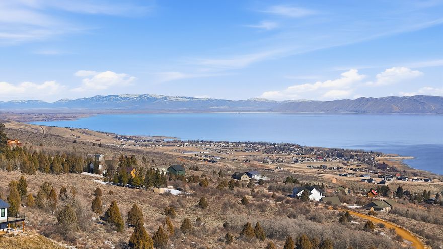 Welcome to 1.19 acres of elevated opportunity on Panorama Drive in Garden City, nestled in the sought-after Sweetwater Subdivision 3. True to its name, this homesite delivers sweeping, unobstructed views of Bear Lake-the kind that stop you mid-sentence and remind you why you chose this lifestyle in the first place.  This is not a crowded vacation lot-this is room to breathe. With nearly an acre and a quarter, you have the flexibility to design a custom primary residence that fits your vision: expansive windows to frame the lake, generous outdoor living spaces, and the privacy that only a larger parcel can provide.  While overnight stays and short-term rentals are not permitted, that's exactly what preserves the peace, pride of ownership, and long-term value of the neighborhood. Sweetwater Subdivision 3 is ideal for homeowners who want consistency, quiet, and community-not transient traffic. Think morning coffee overlooking the water, golden sunsets from your deck, and a home that feels like a retreat every single day.  Located minutes from town amenities, lake access, dining, and year-round recreation, this lot offers the perfect balance of privacy and proximity. Build now or hold for the future-either way, opportunities like this on Panorama Drive are increasingly rare.