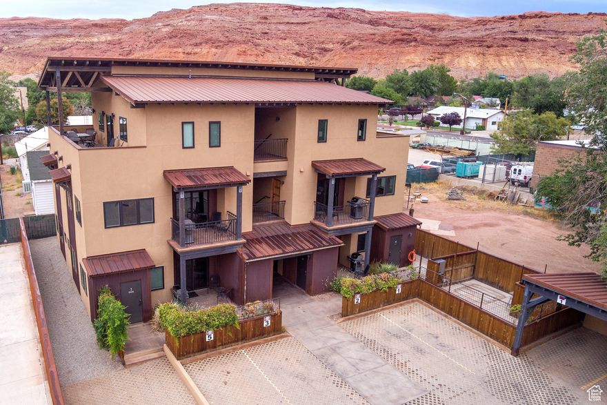Discover 57 Robbers Roost, Unit #2-a 1,095 sq. ft., 2-bedroom, 2-bath condo in the heart of downtown Moab. This spacious unit is fully turn-key, featuring a full kitchen, washer and dryer, central air, fiber internet, bike storage, BBQ grill, and both covered and uncovered parking. Owners and guests can enjoy shared amenities, including a bike repair station, making it the perfect base for red rock adventures. When you're in Moab, it feels like home; when you're away, offset expenses with the opportunity for short-term rentals. Just steps from local restaurants, shops, bars, and year-round events, this property offers the best of convenience and comfort.