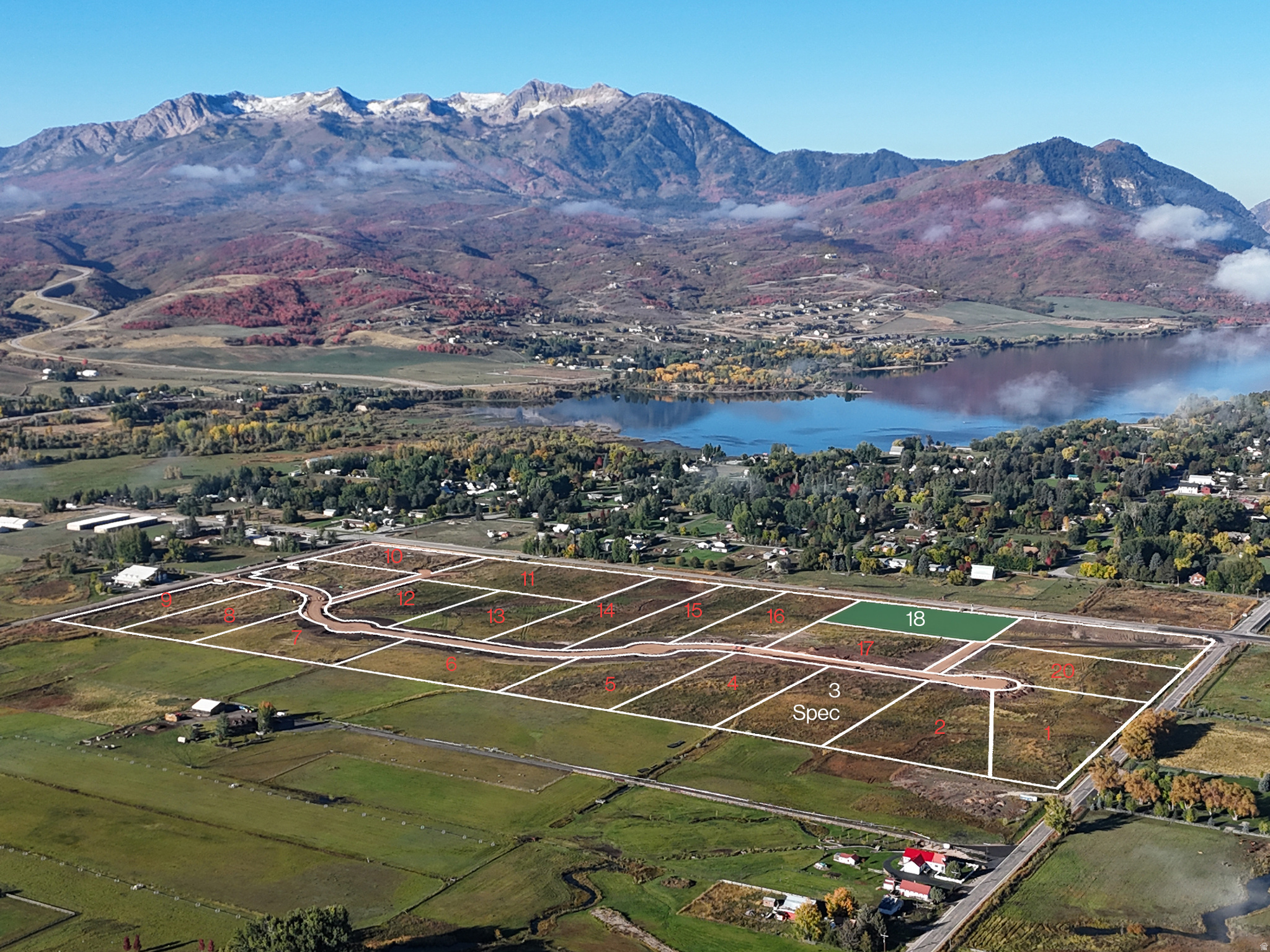 Developed land parcels featuring a paved road infrastructure and marked lot boundaries
