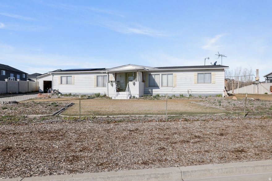 Fantastic opportunity to own a spacious lot in a great South Jordan location! This property features a double-wide modular home and offers plenty of room for outdoor enjoyment, gardening, or future possibilities. Enjoy the convenience of nearby amenities while still having space to spread out and make the property your own. Properties with this much land in such a desirable area are becoming increasingly rare. Buyer and buyer's agent to verify all information.