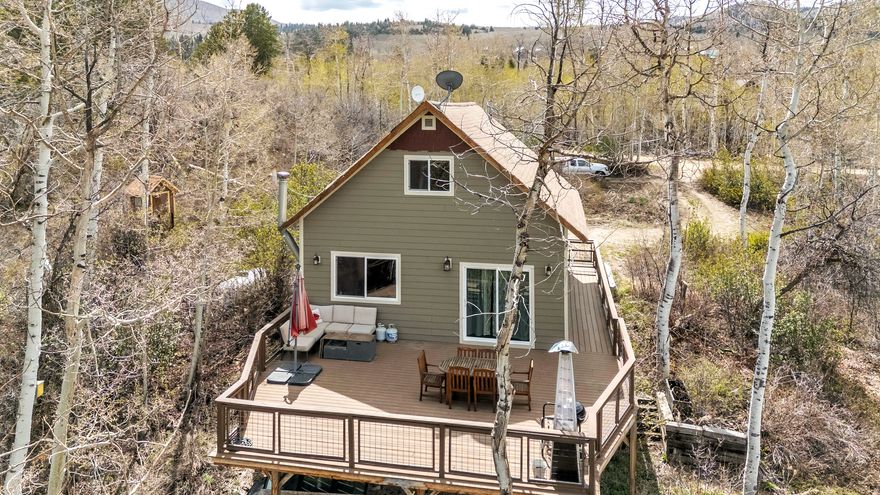 **Additional land available 1.1 Acres MLS 2152909** Have you been dreaming of a cabin in the woods without giving up the convenience of nearby city amenities? This Timberlakes retreat delivers the best of both worlds-offering privacy, breathtaking views, and endless year-round recreation, all just minutes from Heber City.  Tucked back on the lot with a private circular driveway, there's ample parking for guests, trailers, and all your recreational vehicles. The exterior has been thoughtfully updated with newer cement board siding and windows, providing both durability and curb appeal.  Inside, you'll love the abundance of natural light and captivating views from nearly every angle. The main level features a bedroom and full bathroom, along with an open-concept kitchen and great room centered around a cozy wood-burning stove-perfect for gathering after a day outdoors.  Upstairs, you'll find two oversized bedrooms with plenty of space for bunk beds, guests, or private retreats. The basement offers room to grow, including one finished bedroom and additional space ready for a second living area or entertainment zone.  Recent upgrades include a new furnace and water heater, giving you peace of mind. Step outside onto the expansive 800 sq ft Trex deck-ideal for entertaining or simply soaking in the incredible views of Witts Lake, surrounded by mature aspens, pines, and lush mountain foliage.  This is mountain living at its finest-don't miss your chance to make it yours.