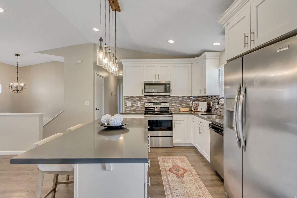 Photo of 5350 S HEW WOOD DR, Taylorsville, UT 84129 (MLS # 2135294)