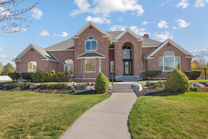 Experience elevated living in this extraordinary Highland estate, where timeless design meets modern luxury on an expansive 0.81-acre lot. Boasting 7,870 square feet of meticulously crafted space, this stunning residence offers 6 bedrooms and 5 bathrooms, delivering both grandeur and comfort at every turn.  From the moment you enter, you're greeted by an impressive, show-stopping staircase that sets the tone for the home's sophisticated design. The flowing layout seamlessly blends formal and functional spaces, including an elegant dining room perfect for hosting memorable gatherings and celebrations.  Designed for both entertaining and everyday living, the home features a  theatre room for an immersive cinematic experience, as well as generous living areas filled with natural light. The open-concept spaces create an ideal setting for connection and luxury living.  Step outside to your private backyard retreat-complete with a covered deck, a 12-person hot tub, and a sprawling yard perfectly suited for large events, outdoor entertaining, or peaceful evenings under the stars.  The fully finished basement offers exceptional versatility, including a private apartment currently generating consistent monthly income-ideal for offsetting expenses or accommodating guests in style.  With abundant storage throughout and thoughtful design in every detail, this home offers the perfect balance of elegance, functionality, and opportunity.  This is more than a home-it's a statement property in one of Highland's most desirable settings.