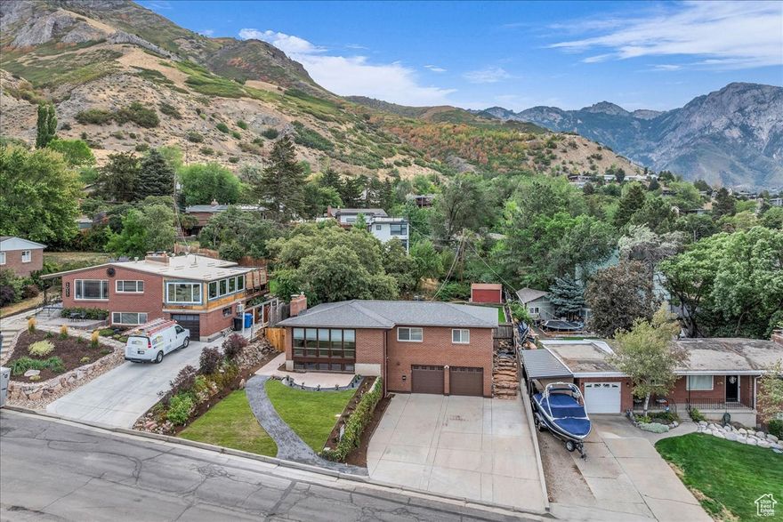 Mountian View's high on the East bench, a private backyard with newly remodeled front and backyard with automatic sprinkler system, a fire pit sitting area with electrical and water close by perfect for entertaining.This bright and happy home is tucked into one of the best neighborhoods around in the Millcreek area with breathtaking views of the valley and mountains, hiking and biking seconds away in walking distance. Upstairs, is a comfy main living space with 3 bedrooms and 2 bathrooms newly remodeled and with dedicated central air in the master bedroom. Windows up graded with double pane storm windows with low e and argon gas filled. Downstairs has 1 bedroom and newly remodeled bathroom, a laundry area and a family room with new carpet and gas fireplace. Roof replaced, Recently painted inside, New shades and window blinds, Automatic sprinkler system, Drought tolerant lawn fire pit sitting/ entertaining area, Concrete walkway and front sitting area, Fencing, Water main and stop and waste replaced Copper and pex hot and cold lines, Newly landscaped front and back yards, Generator and RV hookups, Extra external electrical outlets , Central air, Google fiber internet. Wide driveway with enough space to park 6 vehicles and 2 more in a 2 car garage, a separate entrance walkout basement to the backyard. The best ski resorts in Utah - Snowbird, Alta, Brighton, Solitude, Park City and Deer Valley are all super close as well as Downtown Salt Lake City. Situated near top-rated schools, scenic hiking trails a walk away from the front door, and vibrant shopping and dining options this house is great and in a great little pocket on the benches. Great space, awesome location