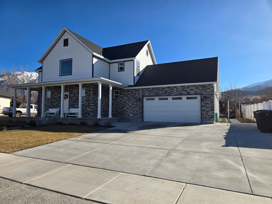 Appraisal came in at $879,900 in late fall. Price has been reduced $70,000, now only $799,900! Gorgeous home and basement apartment that could easily be an ADU, with Payson City approval. This home boasts of a primary suite and laundry on all three levels. Beautiful kitchens on the main level and the basement apartment with quartz counter tops, kitchen islands, and great rooms. Large bedrooms with four bedrooms having walk-in closets. Basement apartment comes with 2 bedrooms, 2 bathrooms, and walk out entrance. You can also access the apartment from inside. Separate alarm systems for the home and the apartment. Also comes with alot of cold storage under the wrap around porch. Added feature is a gardeners dream in the backyard, and side of house with 21 raised beds. Home also has a wraparound porch, dog run, large 3 car garage that extends into the backyard with garage door. You will also enjoy the neighborhood, and all your great neighbors! Measurements from Utah County records are provided as a courtesy estimate only. Buyer to verify all information.