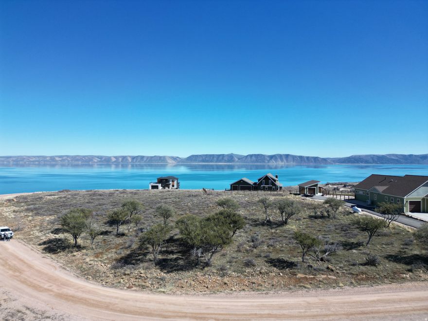 Do you love sunsets? Would you like to have a home in a gated community?  Swan Creek has some of the most amazing views of Bear Lake, this lot also has beautiful views of the mountains.  In the fall the trees explode with color.  The lot is flat and easily buildable. See https://swancreekvillage.org/  Home page for information about building your dream adventure in Bear Lake.