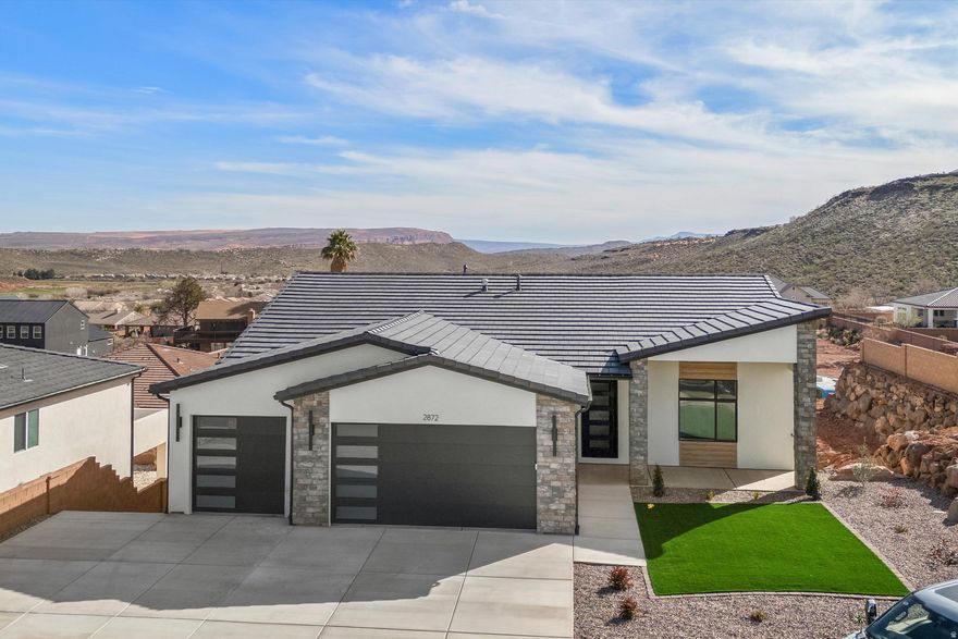 Stunning 2026 new construction in the desirable Coral Canyon community of Burke Springs in St. George! This modern home features 6 bedrooms, 4 bathrooms, and a private ADU-ideal for guests, multi-generational living, or rental income. Eye-catching contemporary exterior with stone accents . Inside, enjoy a bright, open-concept layout with spacious living areas perfect for entertaining. The kitchen flows seamlessly into the main living space, creating a welcoming and functional design. Thoughtful finishes and quality craftsmanship throughout. Low-maintenance desert landscaping, generous driveway, and ample garage space. Conveniently located near golf, hiking, and all the outdoor recreation Southern Utah is known for. A rare opportunity to own a versatile, move-in-ready home in one of St. George's most sought-after communities!