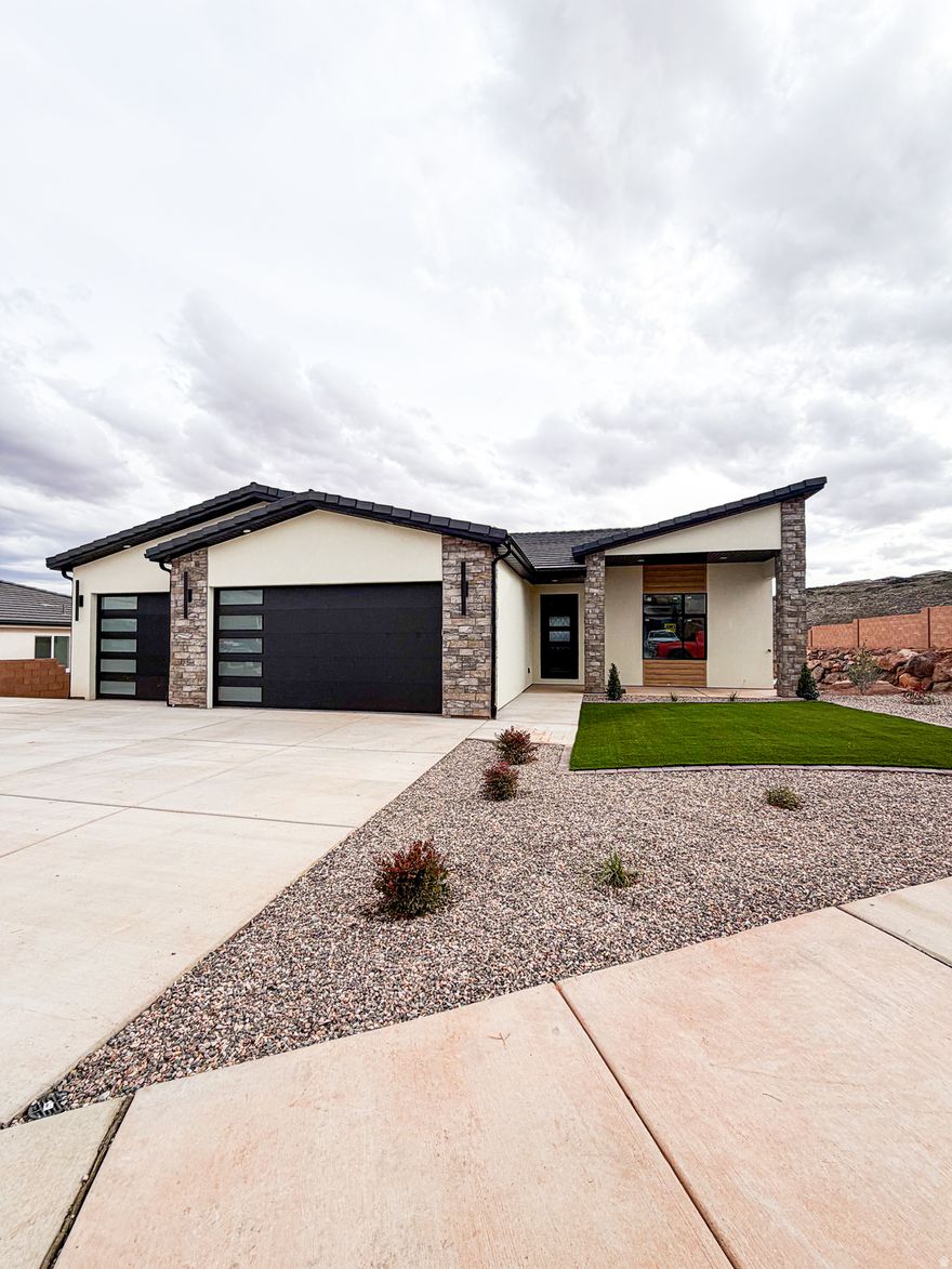 Stunning 2026 new construction in the desirable Coral Canyon community of Burke Springs in St. George! This modern home features 6 bedrooms, 4 bathrooms, and a private ADU-ideal for guests, multi-generational living, or rental income. Eye-catching contemporary exterior with stone accents . Inside, enjoy a bright, open-concept layout with spacious living areas perfect for entertaining. The kitchen flows seamlessly into the main living space, creating a welcoming and functional design. Thoughtful finishes and quality craftsmanship throughout. Low-maintenance desert landscaping, generous driveway, and ample garage space. Conveniently located near golf, hiking, and all the outdoor recreation Southern Utah is known for. A rare opportunity to own a versatile, move-in-ready home in one of St. George's most sought-after communities!