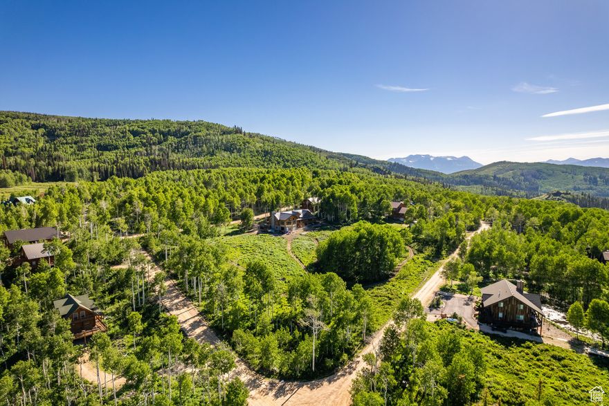 Don't miss this rare opportunity to own a beautiful, wooded corner lot nestled in the heart of upper Timber Lakes. Surrounded by peaceful aspen groves, this gently sloping lot offers an ideal setting for your mountain getaway-whether you're looking to build a full-time residence or a seasonal escape. This lot comes ready to go with a passed percolation test, septic design, and custom building plans included-saving you time and money as you bring your vision to life. Located in a private, gated community just minutes from downtown Heber City, Timber Lakes offers year-round access and an unbeatable mix of natural beauty and outdoor adventure. Enjoy direct winter access to millions of acres of Uinta National Forest, perfect for snowmobiling, snowshoeing, and backcountry exploration. In the warmer months, explore miles of scenic ATV trails, hiking paths, tranquil lakes, streams, and picnic areas. Additional nearby activities include world-class golf, skiing, boating, fishing, and mountain biking-all just 35 minutes from Park City and about an hour from Salt Lake City or Provo. Whether you're looking for serenity, adventure, or both-this stunning lot offers the perfect basecamp for mountain living.
