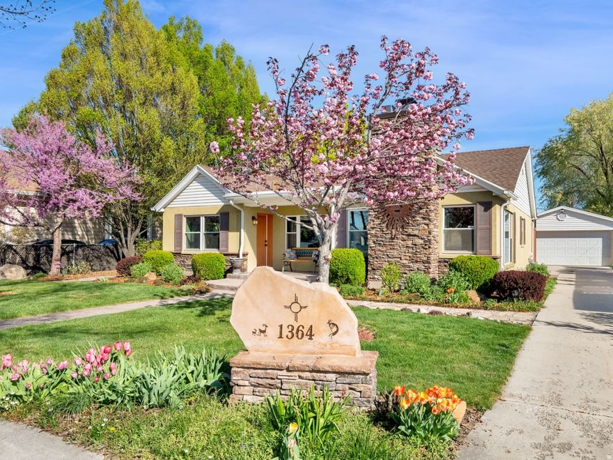 This charming single-level 3-bedroom, 1.5-bath home blends comfort and versatility. It is close to downtown and to the airport. The extra-large garage has wiring for EV setup, a workbench, and ample room for vehicles, hobbies, and storage. There is easy access to the University via public transportation. Inside, the home features stylish bamboo flooring, wood blinds and draperies that add warmth and year-round comfort. An additional front entrance could allow for a private office with a half bath, or convenient, multigenerational living. Outside, a professionally landscaped yard features a xeriscape park strip, perennial flowers, and mature shade trees. Automatic lighting triggers at sundown. The fenced back yard allows for relaxing on the deck which has custom shade awnings, or to entertain family and friends on the large brick patio. The back part of the parcel offers a greenhouse and vegetable garden, an apple tree, and raspberries to encourage self-sufficient living. For future development, the lot is zoned for an ADU. This property offers a rare combination of charm, function, and flexibility both inside and out. This home is a must see!