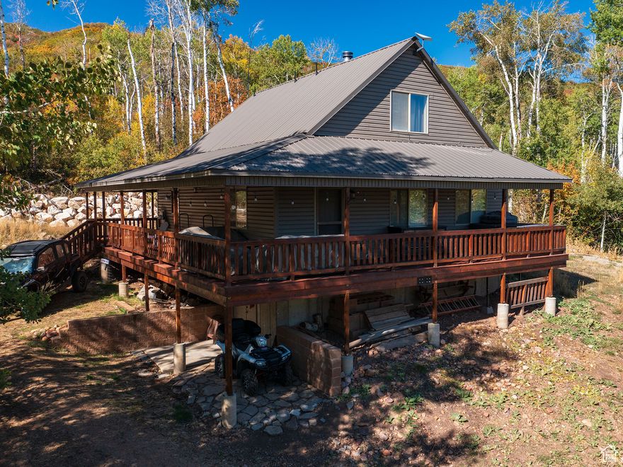 AMAZING SELLER INCENTIVES INCLUDED!  With an acceptable offer, the seller is including a 2009 Polaris Ranger XP 700 with tracks, a snow coach, Starlink high-speed internet system, abundant firewood, log splitter, chain saws, and select furnishings. This exceptional turn-key mountain lifestyle package rarely offered in Causey Estates! 14816 E Austin Circle  Mountain Luxury Retreat Above Causey Reservoir Nestled above Causey Reservoir in the gated community of Causey Estates, this beautifully maintained 3-bedroom, 2-bath cabin offers the perfect mountain retreat. Surrounded by mature quaking aspens with stunning mountain views, the property includes power, septic, and an HOA-maintained spring-fed water system for year-round comfort. The freshly stained three-quarter wraparound deck with shade screens provides inviting outdoor living. Enjoy a morning soak in the hot tub, peaceful mountain walks, or evenings watching abundant wildlife from your private deck. The large corner lot features a U-shaped in-and-out driveway, generous parking for guests, RV parking with a waste hookup, and a spacious storage shed. Inside, the cabin includes a Bosch dishwasher, LG refrigerator, range, microwave, and a Fisher large box wood-burning stove that warms the living area. A smart thermostat controls the furnace, and a window evaporative cooler provides summer comfort. The walk-out basement offers a mud and laundry room with propane wall-mounted heaters and an unfinished space ideal for storing ATVs, creating a game room, or future expansion. Whether for weekend escapes or extended stays, this cabin blends rustic charm with modern conveniences, making it a rare find in Causey Estates. Beautiful engineered hardwood flooring throughout creates a warm inviting space. Square footage figures are provided as a courtesy estimate only and were obtained from county records. Buyer is advised to obtain an independent measurement.