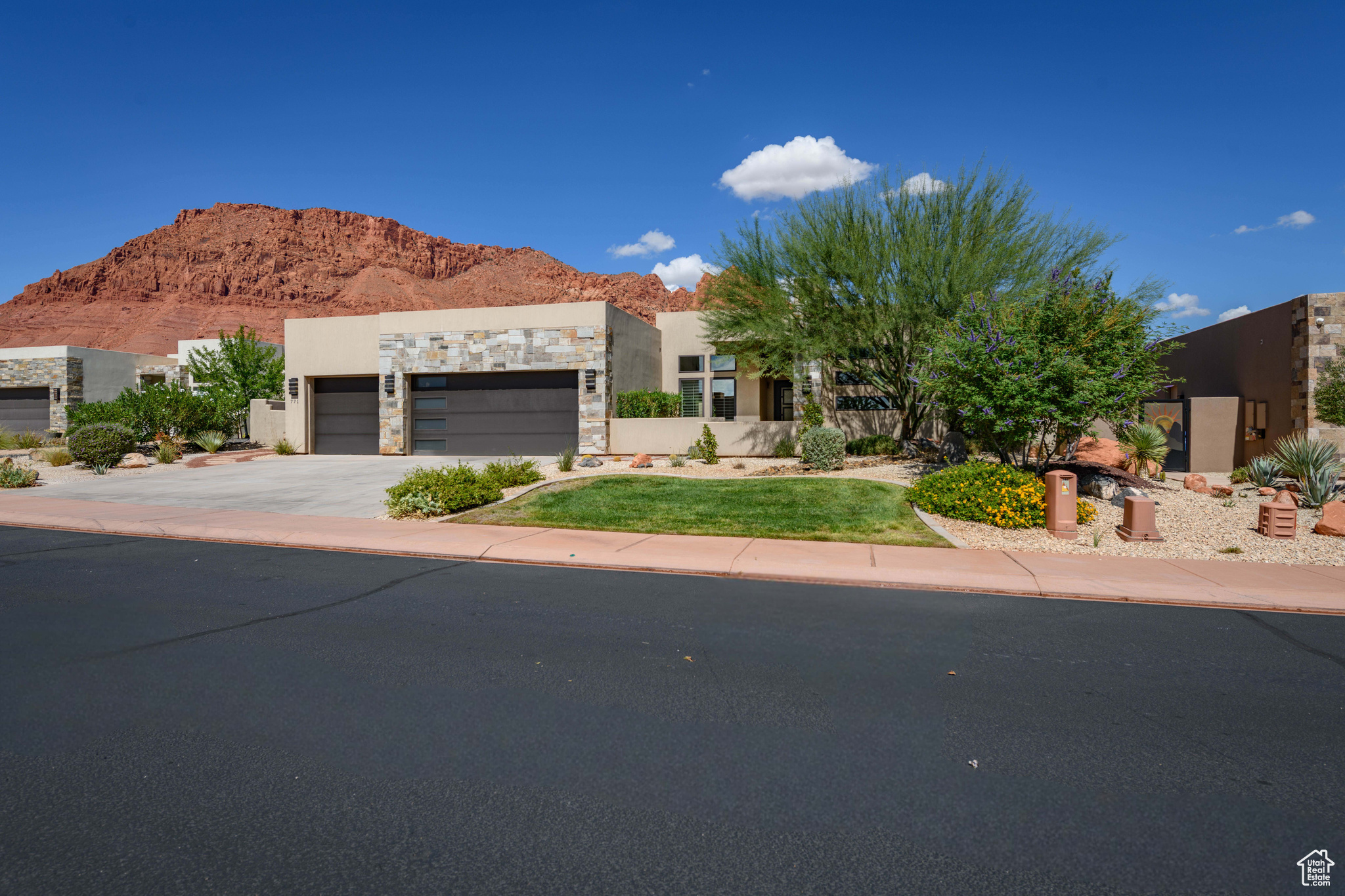 Located at the base of the iconic red cliffs of Ivins, this single-level home offers modern design and function. The 2,524 sq. ft. main home plus 339 sq. ft. detached casita create a layout ideal for both everyday living and hosting. The great room and kitchen flow into a split floor plan, with the primary suite privately set apart. Two guest bedrooms and a bath sit on the opposite side for added privacy. The detached casita provides flexible space for guests or an office. On .34 acres, the yard offers room to add a pool. Resort-style amenities at The Palisades include multiple pickleball courts, tennis, basketball, clubhouse, fitness center, large pool, hot tub, and outdoor kitchen-all in a secure gated setting minutes from Snow Canyon & Tuacahn.