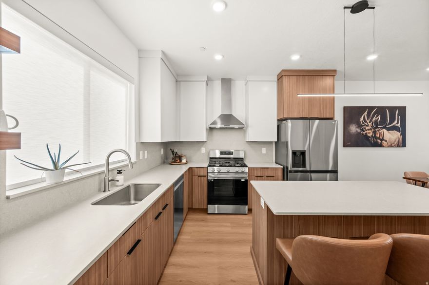 Feels like new! Built in 2024, this modern, luxury townhome is located in the RARE NIGHTLY RENTAL APPROVED ZONE (MU-5). Thoughtfully designed for urban living with two upstairs primary suites featuring vaulted ceilings, walk-in closets, and spa-inspired en-suite bathrooms, plus a ground-level third bedroom ideal for a home office, guest room, or flex space. The open-concept main level offers waterproof LVP flooring, half bath, laundry, and a chef's kitchen with European-style soft-close cabinetry, matte quartz countertops, LG stainless steel appliances, vented range hood, oversized island, and large walk-in pantry. A rare two-car garage adds convenience and storage. Built for efficiency with a tankless water heater and 95% efficient furnace. CAT6 wiring and dedicated Google Fiber port included. Featured in the Salt Lake Parade of Homes. HOA and zoning allow nightly rentals. (Airbnb earnings data available. Furnishings negotiable.) Welcome to Townes at Marmalade.