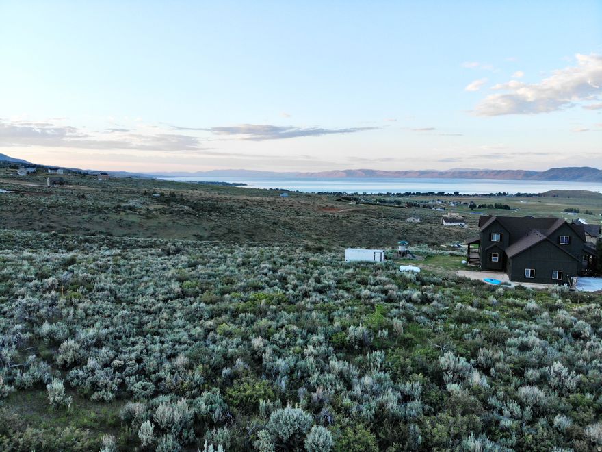 Larger lot that can accommodate that home you have been dreaming of building! Lot is flat and makes for an easier build. Views, views, views.... including Beautiful Bear Lake. Lot backs up to a ravine and common ground, so you will never have an obstructed view. Power is stubbed to the lot including water and sewer. No natural gas up here, so you can choose your own propane company to use.  HOA fee is yearly at $400 a year.