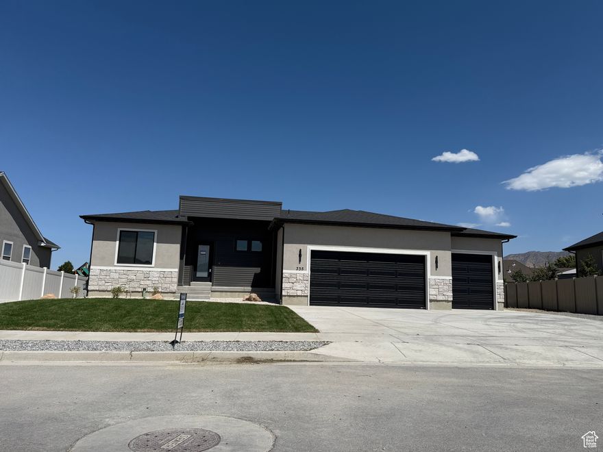 Big Dreams Development is proud to offer this customized rambler. This home has a finished basement with: seperate entrance, laundry, kitchen, cold storage, City permited Accessory Dwelling Unit rentable income is possible. Located in the very private new state-of-the-art Sunnyside Estates subdivision. There are two washer and dryer hookups, Let QUALITY be your guide: Architectural shingles with ice damn protection, full rain gutters front, BMC case base and lumber package, Upgraded insulation, fiber bonded stucco, Linear fireplace,high-efficiency 360-degree furnace-central air unit, On-demand water heater, custom welded railings, extra concrete surrounding, custom LEC cabinets, custom kitchen backsplash, large stair width, multi-colored paint, painted garage interior, anti-pinch protected Martin garage doors with wifi IQsmart app remote garage openers, Amsco insulated gas filled windows, upgraded tile, Laminate Mohawk flooring, Metal Moen plumbing fixtures, upgraded tubs, and tile High walls in bathrooms, already stubbed for fiber internet, water softener, sprinkler stop&waste. Basement finished with a kitchen, bathroom, bedrooms, family room, Huge cold storage and additional under stair and dry storage_craft room, and a separate walkout-entry. ******If you use our preferred lender, the seller will contribute up to $10,000 of the buyer's closing costs or interest rate buy down***** Only 30 minutes from downtown Salt Lake City, easy access to SR 36.