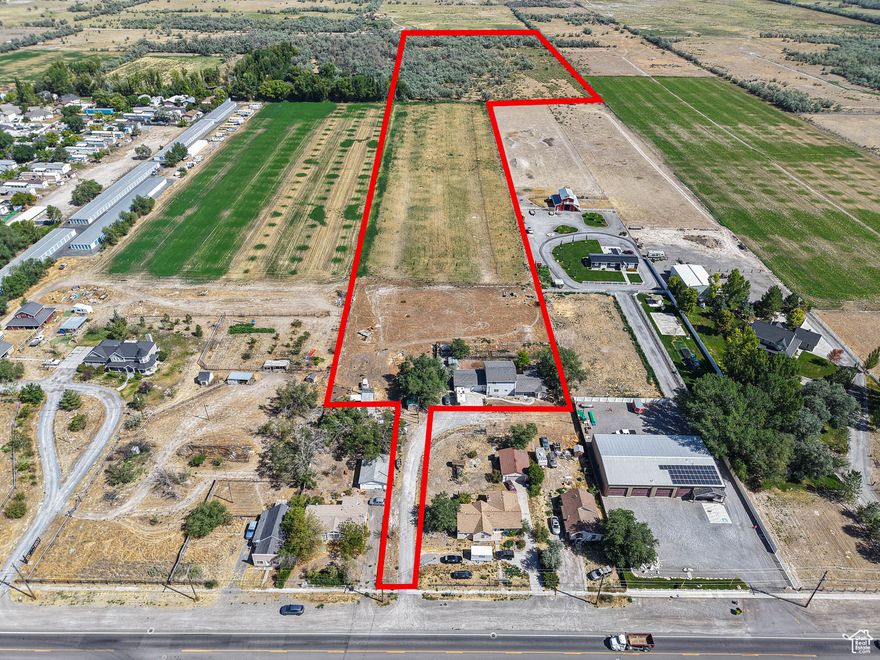 Development opportunity, Land in Grantsville with Frontage on Main Street in great location.  Total of 25.96 acres which includes two properties 690 E MAIN ST, 25.62 Acres with Tax ID 12-102-0-0003 & 697 E MAIN ST, .34 Acres with Tax ID 12-102-0-0002. Two properties must be sold together; value is in the land. Seller has both Culinary (acre feet) and Irrigation shares that are not included in the price, The amount of water and price must be negotiated separately. There is also additional land available, call agent for details
