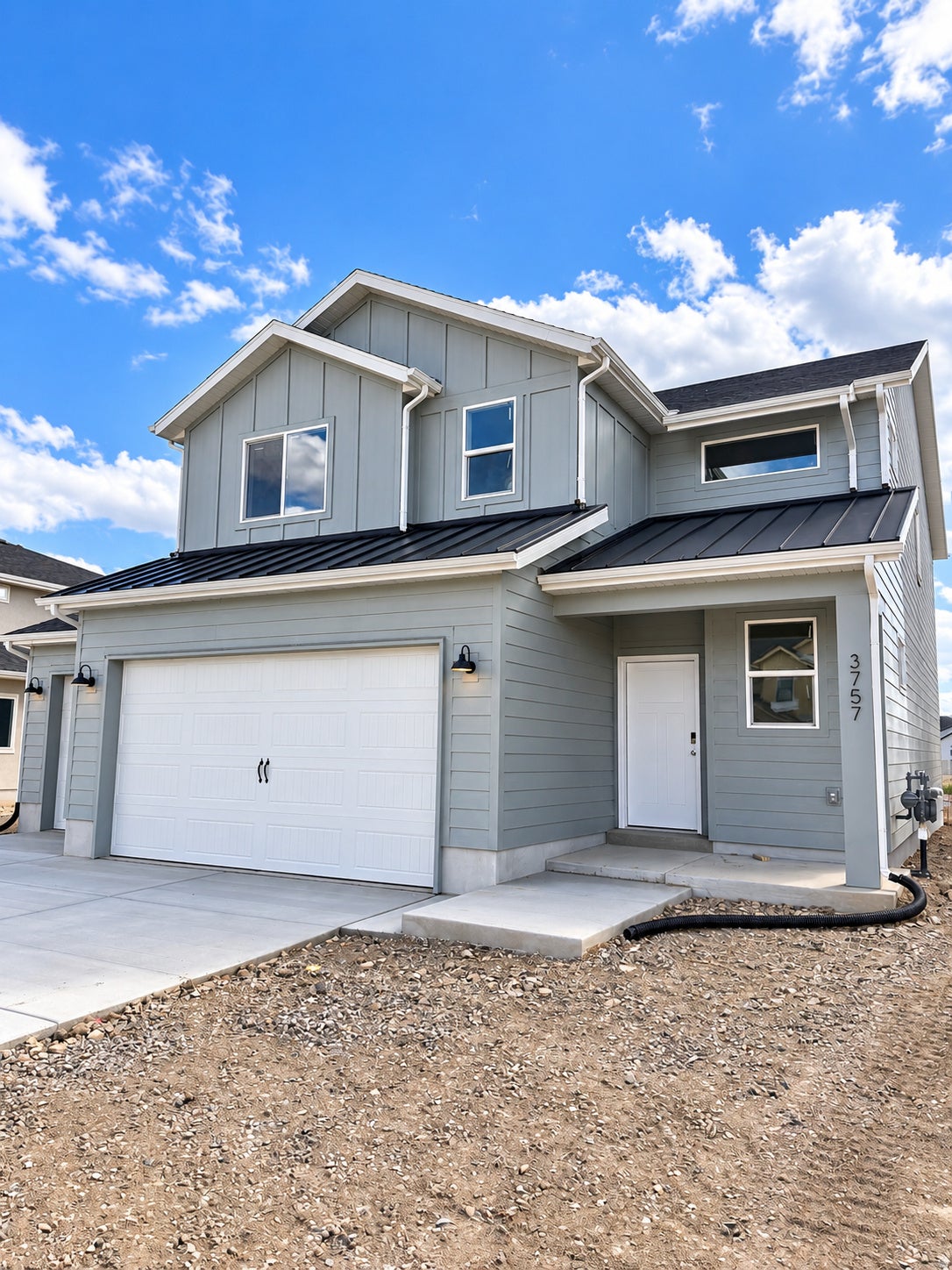 Gray Farmhouse With Third Car Garage