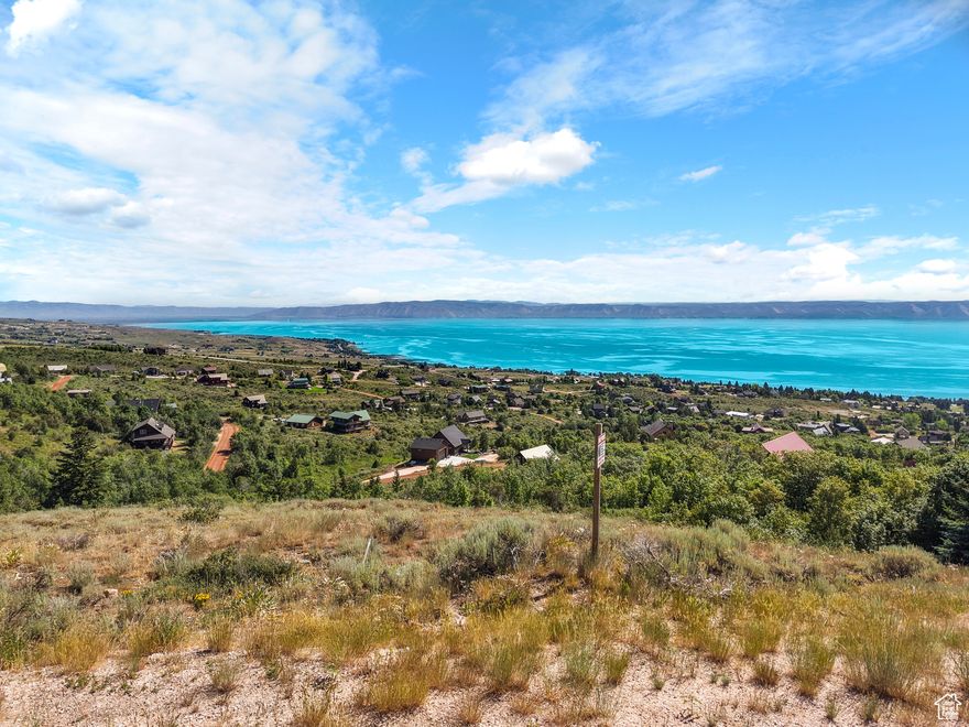 Scenic Views from a Prime Building Lot in the Desirable Bear Lake West Neighborhood. Embrace the tranquility that Bear Lake provides, complete with stunning wildlife and lake vistas. Spend leisurely summer days at your very own Bear Lake Getaway. This property features 1.07 acres of gentle slopes and a south-facing driveway, perfect for your dream getaway.