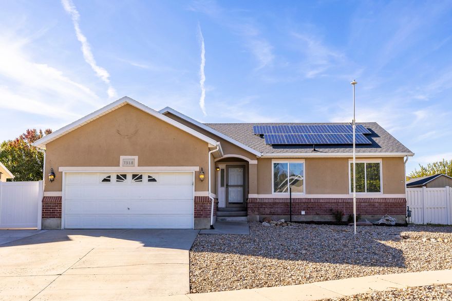 Perfect for investors or homeowners looking to offset their mortgage, this beautifully updated rambler offers a full mother-in-law apartment with a separate kitchen, entrance, laundry, and off-street parking. Built in 1999 and thoughtfully refreshed, the home combines comfort, flexibility, and modern convenience. The low-maintenance xeriscaped front yard and fully fenced backyard feature raised garden beds, a 14x14 deck, a detached workshop, storage shed, and chicken coop. Inside, the main level offers an upgraded kitchen with abundant cabinetry, three bedrooms including a primary suite with walk-in closet, and an attached two-car garage. Ideal for multi-generational living, rental income, or an investor's portfolio, this home delivers timeless style and everyday functionality.