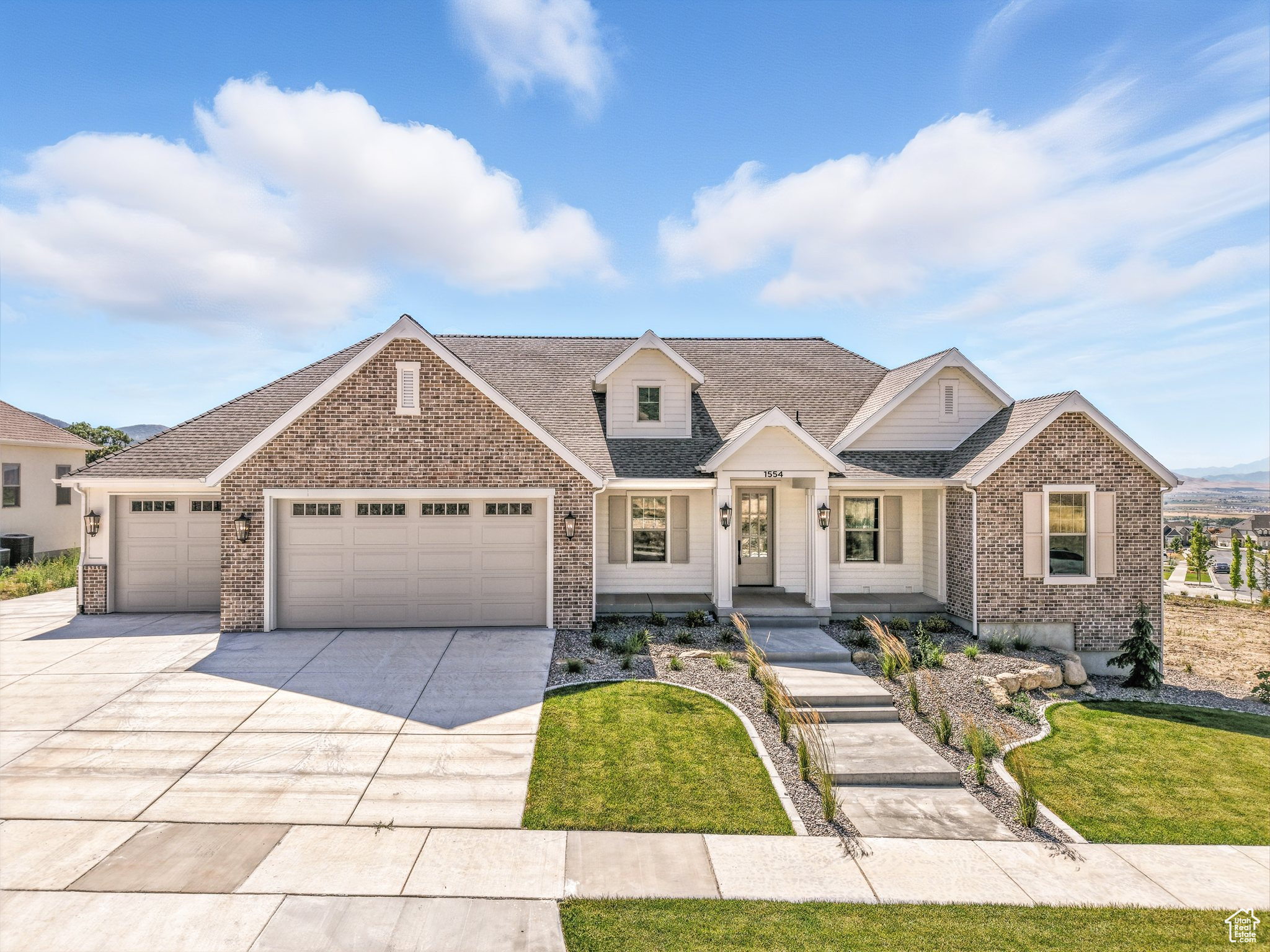 Major Price Improvement + Front Yard Landscaping Included! Stunning Custom Wellington Floor Plan by Valor Homes-designed with quality, space, and luxury in mind. This home features vaulted ceilings, an open-concept layout, and a 10' basement ceiling height with a full gym, snack bar, and a finished theater room. The spacious walk-out basement adds natural light and extra living space. Enjoy high-end finishes throughout, including quartz countertops, designer lighting, and custom cabinetry. Modern conveniences include a tankless water heater, smart thermostats, and a 220V EV charging outlet. Relax or entertain on the large deck with panoramic mountain and valley views. Located on a quiet cul-de-sac in one of the area's most desirable neighborhoods. This home is move-in ready with front yard landscaping included. Schedule your private showing today!